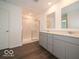 Modern bathroom with double sinks, sleek vanities, and a glass-enclosed shower for a spa-like experience at 1618 Trichel Dr, Greenwood, IN 46143