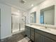 Modern bathroom featuring a double sink vanity, a glass-enclosed shower, and stylish fixtures at 1618 Trichel Dr, Greenwood, IN 46143