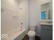 This bathroom showcases a bathtub with shower, modern fixtures, and a coordinated vanity at 1618 Trichel Dr, Greenwood, IN 46143