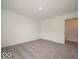A simple bedroom with neutral carpeting and light walls at 1618 Trichel Dr, Greenwood, IN 46143