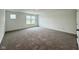 Cozy bedroom featuring plush carpeting and a large window offering great natural light at 1618 Trichel Dr, Greenwood, IN 46143