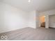 Spacious bedroom featuring neutral carpet, an ensuite bathroom, and ample natural light at 1618 Trichel Dr, Greenwood, IN 46143