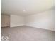 Expansive bonus room with neutral carpet and ample space for various activities or uses at 1618 Trichel Dr, Greenwood, IN 46143