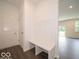 Bright entryway with bench, coat hooks, and access to other living spaces at 1618 Trichel Dr, Greenwood, IN 46143