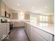 Bright, modern kitchen with gray cabinets, a large island, and stainless steel appliances at 1618 Trichel Dr, Greenwood, IN 46143