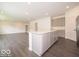 Open concept kitchen featuring gray cabinets, large island, and stainless steel appliances at 1618 Trichel Dr, Greenwood, IN 46143