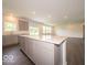Open kitchen layout featuring a large island with white countertop and grey cabinets at 1618 Trichel Dr, Greenwood, IN 46143