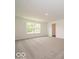 This room offers lots of light through the large window at 1618 Trichel Dr, Greenwood, IN 46143