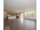 Open-concept kitchen and living area featuring stainless appliances and abundant natural light at 1618 Trichel Dr, Greenwood, IN 46143