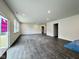 Bright living room with hardwood floors, recessed lighting, and plenty of natural light at 1618 Trichel Dr, Greenwood, IN 46143
