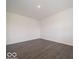 Spacious living room with dark hardwood floors, ready for your personal touch at 1618 Trichel Dr, Greenwood, IN 46143