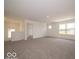 Open loft area with plush carpeting, natural light, and versatile space for relaxation or entertainment at 1618 Trichel Dr, Greenwood, IN 46143