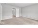 Neutral bedroom with access to additional rooms and neutral colored carpet at 2011 Blue Pine Ln, Indianapolis, IN 46231
