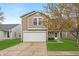 Charming two-story home featuring a two-car garage, well-maintained lawn, and lovely curb appeal at 2011 Blue Pine Ln, Indianapolis, IN 46231