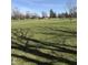Picturesque view of the lush green golf course and mature trees on a sunny day at 2100 Sunnybrook Ln, Lebanon, IN 46052