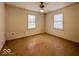 An empty bedroom has natural light from two windows and a ceiling light at 2207 E Dudley Ave, Indianapolis, IN 46227