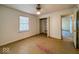 This bedroom offers natural light from a window and closet space for storage at 2207 E Dudley Ave, Indianapolis, IN 46227