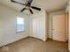 Standard bedroom with a ceiling fan, closet and natural light at 2207 E Dudley Ave, Indianapolis, IN 46227