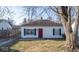 Charming single-story home featuring a red front door and classic blue shutters at 2207 E Dudley Ave, Indianapolis, IN 46227