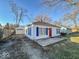 Charming home with detached garage with ample driveway parking and well-maintained lawn at 2207 E Dudley Ave, Indianapolis, IN 46227