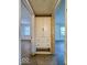 A hallway with built-in cabinets leads to empty rooms with natural light from the windows at 2207 E Dudley Ave, Indianapolis, IN 46227