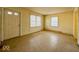 The empty living room has natural light coming through multiple windows and a front door at 2207 E Dudley Ave, Indianapolis, IN 46227