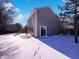 A fully fenced backyard with a sliding glass door, ideal for entertaining during the winter at 2257 Grand Fir Dr, Greenwood, IN 46143