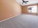 Bright bedroom with neutral carpeting, a window for natural light, and a spacious feel at 2257 Grand Fir Dr, Greenwood, IN 46143