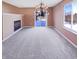 Spacious dining area featuring a modern chandelier, fireplace, and sliding glass doors to the backyard at 2257 Grand Fir Dr, Greenwood, IN 46143