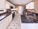 Modern kitchen with stainless steel appliances, granite countertops, and ample cabinet space at 2257 Grand Fir Dr, Greenwood, IN 46143