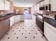 Well-lit kitchen boasts white cabinets, black countertops, and modern stainless steel appliances at 2257 Grand Fir Dr, Greenwood, IN 46143