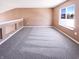 Upstairs loft area offers a flexible space with great natural light and neutral carpet at 2257 Grand Fir Dr, Greenwood, IN 46143
