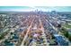 An aerial shot shows a dense urban neighborhood with diverse architecture and city skyline in the background at 2432 N Talbott St, Indianapolis, IN 46205
