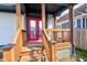 Inviting back porch with wooden beams and a red door, perfect for enjoying the outdoor space at 2432 N Talbott St, Indianapolis, IN 46205