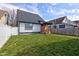 Charming home with a fenced backyard and a cozy porch, perfect for outdoor entertaining at 2432 N Talbott St, Indianapolis, IN 46205