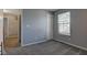 Bedroom with gray carpet and a large window at 2432 N Talbott St, Indianapolis, IN 46205