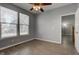 Bright bedroom features wood-look flooring, two windows, and a ceiling fan at 2432 N Talbott St, Indianapolis, IN 46205