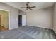 A well-lit bedroom featuring neutral walls, patterned carpet, and a ceiling fan for added comfort at 2432 N Talbott St, Indianapolis, IN 46205