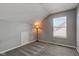 Bedroom features neutral carpet, window, and sloped ceiling at 2432 N Talbott St, Indianapolis, IN 46205