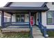 Welcoming front porch featuring a seating area and views of the landscaped yard at 2432 N Talbott St, Indianapolis, IN 46205