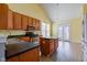 Kitchen with wooden cabinets, an island, and stainless steel appliances at 2432 N Talbott St, Indianapolis, IN 46205