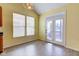 A kitchen or dining area featuring french doors opening to a deck and two large windows for natural light at 2432 N Talbott St, Indianapolis, IN 46205