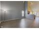 Spacious living room with vaulted ceilings, wood-look floors and natural light at 2432 N Talbott St, Indianapolis, IN 46205