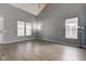 Spacious living room with vaulted ceilings, wood-look floors and large windows at 2432 N Talbott St, Indianapolis, IN 46205