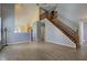 Living room with wood-look floors and stairs leading to the second floor at 2432 N Talbott St, Indianapolis, IN 46205