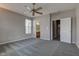 A spacious main bedroom featuring neutral paint, carpet flooring, and multiple doors leading to other rooms at 2432 N Talbott St, Indianapolis, IN 46205