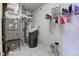 Utility room featuring a water heater, water filtration system, and a modern furnace for home comfort at 2432 N Talbott St, Indianapolis, IN 46205