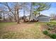 Large backyard featuring lush lawn and a deck offers a great outdoor living and entertainment space at 3029 Oberlin Ct, Indianapolis, IN 46268