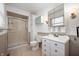 Bathroom features a glass shower, tile floors, white vanity, and a toilet at 3029 Oberlin Ct, Indianapolis, IN 46268
