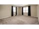 Bedroom with neutral carpet, two windows with dark curtains, and neutral-colored walls at 3029 Oberlin Ct, Indianapolis, IN 46268